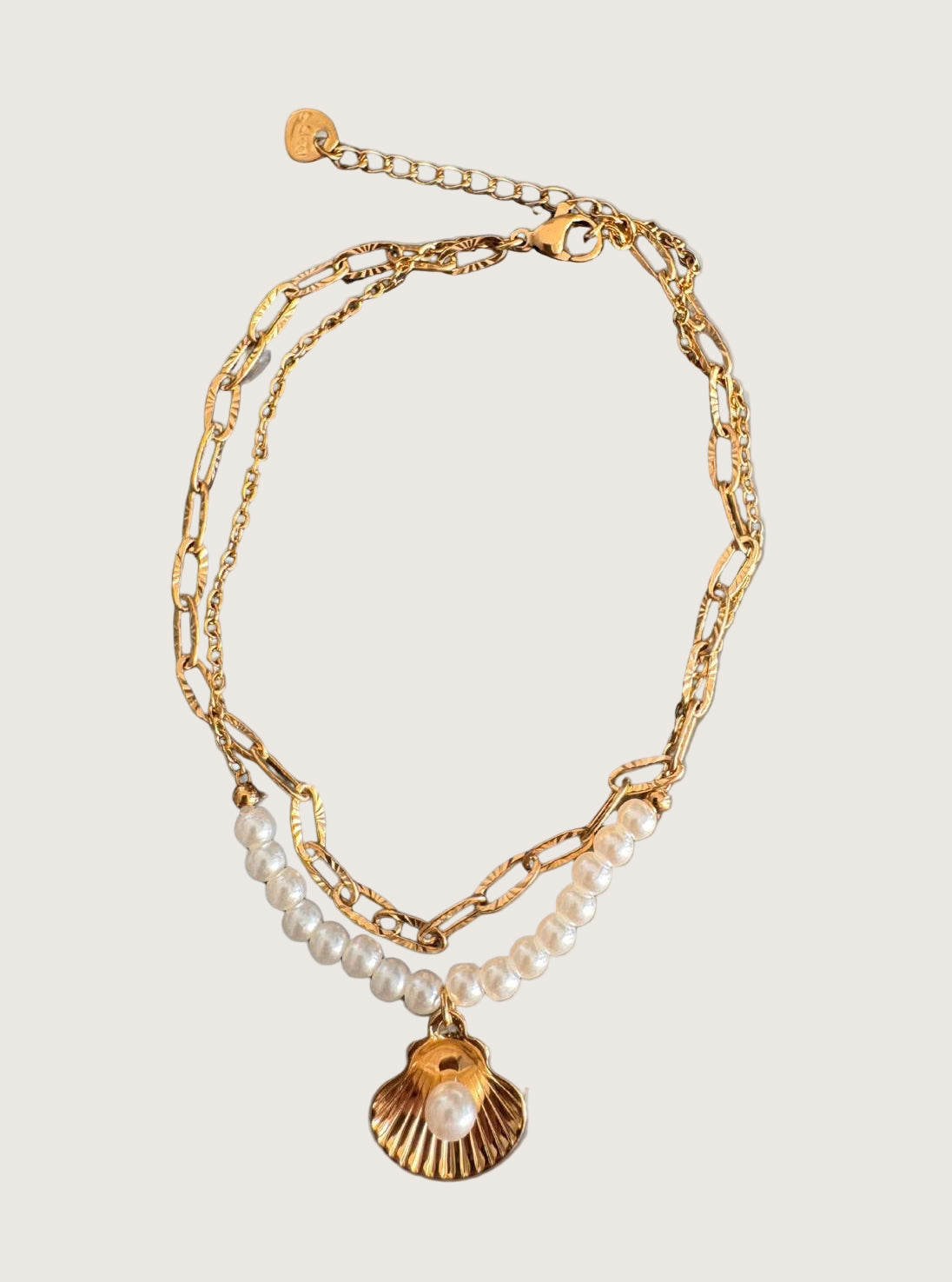 Chaîne de cheville double coquillage